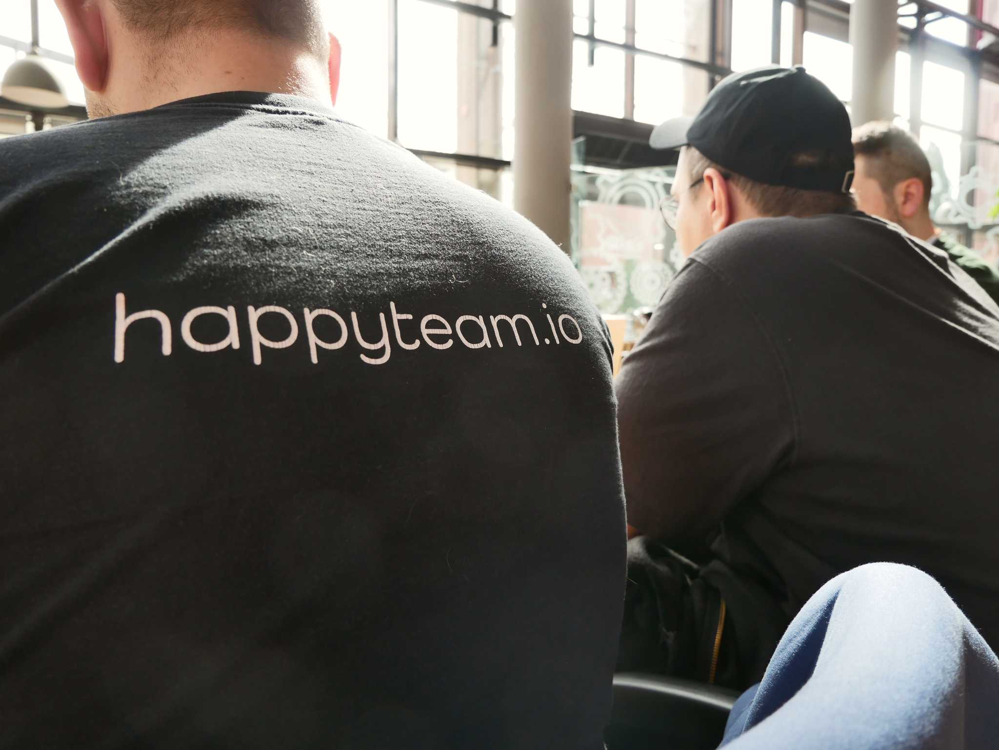A happy developers sitting next to each other.
